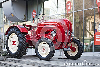 Porsche Junior tractor parked in front of a hotel Editorial Stock Photo