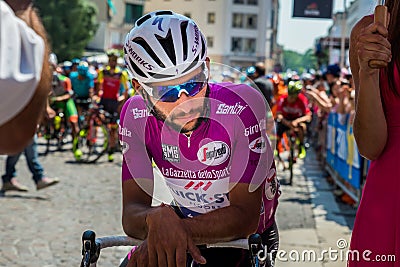 Pordenone, Italy May 27, 2017: Professional cyclist Fernando Gaviria Quick Step Team, in purple jersey, in first line. Editorial Stock Photo