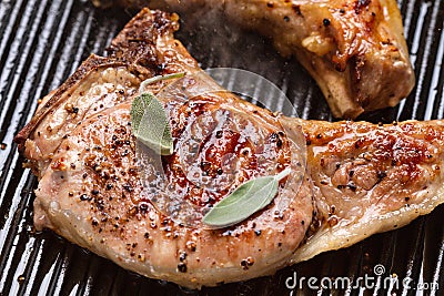 Pork chop in a frying pan grill closeup Stock Photo
