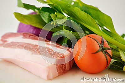 Pork, green vegetables, onions and tomatoes, all kinds of vegetables Stock Photo