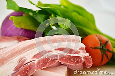 Pork, green vegetables, onions and tomatoes, all kinds of vegetables Stock Photo