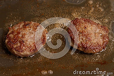 Pork Meat being cooked on grill Stock Photo