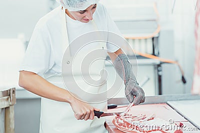 Meat cutting in butchery Stock Photo