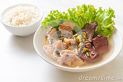 pork\'s entrails and blood jelly soup with rice Stock Photo