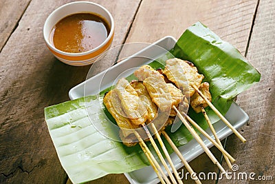 Pork satay,Grilled pork served with peanut sauce or sweet and sour sauce Stock Photo