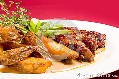 Pork steak with baked potatoes Stock Photo