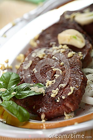 Pork steak with garlic Stock Photo