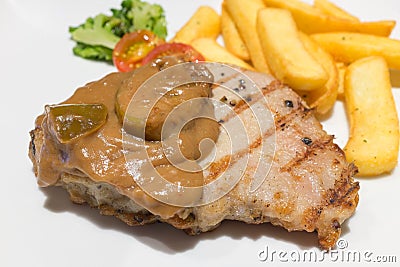 Pork steak serve with apple sauce for dinner Stock Photo