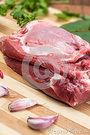 Pork tenderloin for Vietnamese dish preparation on a wooden board Stock Photo