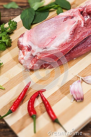 Pork tenderloin for Vietnamese dish preparation on a wooden board Stock Photo
