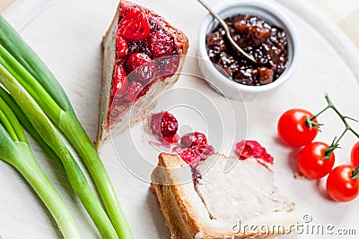 Pork and turkey pie with cranberries, chutney and tomatoes Stock Photo