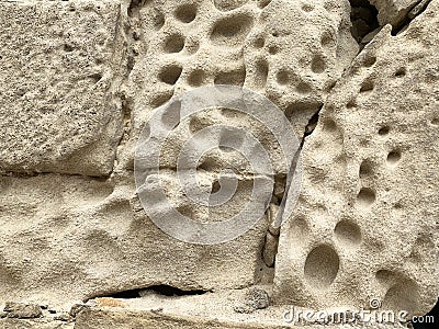 The porous structure of the stone from which the Palace of Shirvanshahs was built in the historic district of Icheri Sheher Old t Stock Photo