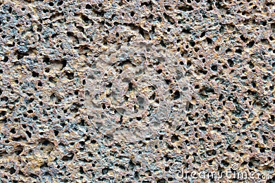 Porous volcanic rock wall. Stock Photo