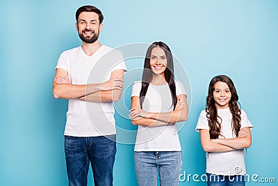 Porrait of positive cheerful three people true entrepreneurs ready to solver problems wear white t-shirt denim jeans Stock Photo