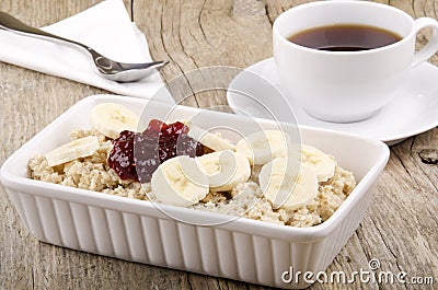 Porridge with banana slices and raspberry marmalade Stock Photo