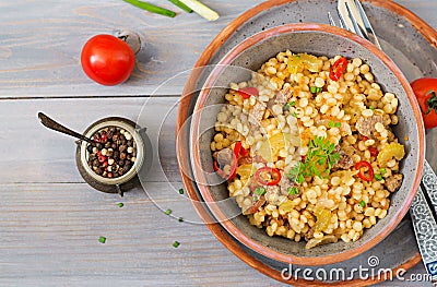 Porridge from Turkish couscous with beef and vegetables Stock Photo