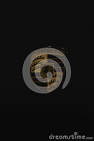 The porsche logo in front of dark background Editorial Stock Photo