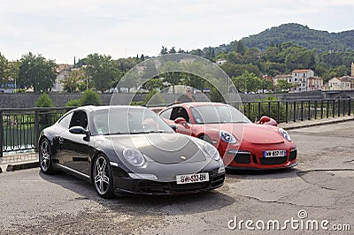 Porsche sports cars including a red GT3 on a parking Editorial Stock Photo