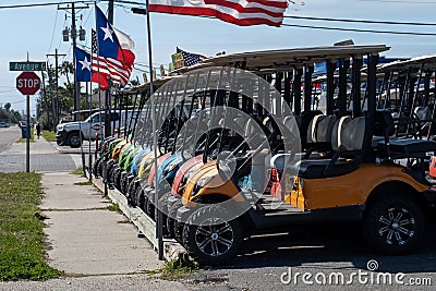 PORT ARANSAS, TX - 8 FEB 2020 - Colorful golf carts, lined up for rent Editorial Stock Photo