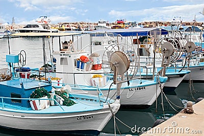Port with blue and white fishing boats. Greece, Cyprus Editorial Stock Photo