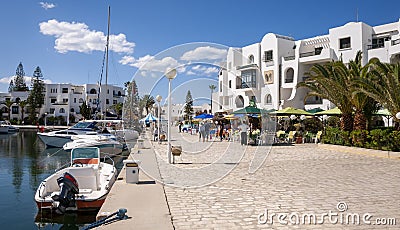 Port El Kantaoui Tunisia cafes by the harbour with modern buildings and boats. Stock Photo