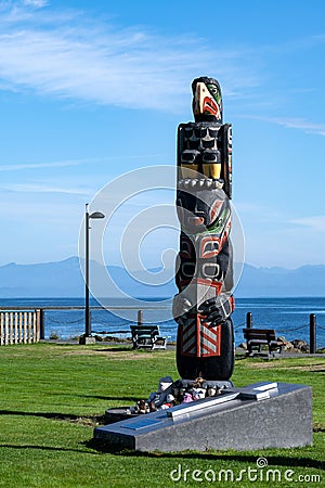 Vertical shot of the Totem Pole at Carrot Park in Port Hardy, Vancouver Island, Canada Editorial Stock Photo