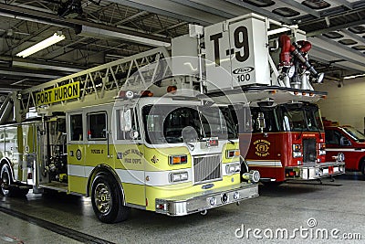 Fire trucks sit inside the Port Huron Fire station house Editorial Stock Photo