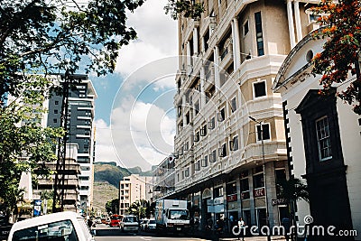 Port Louis, Mauritius view of a city street with heavy traffic. on the first floor of the building there is a cafe Editorial Stock Photo