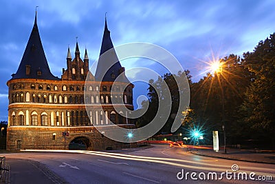 Port LÃ¼becks Holsten Gate at night Editorial Stock Photo