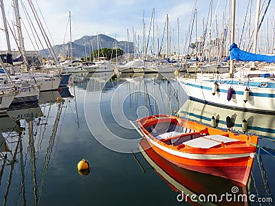 Orange boat in the port of palermo in Sicily, Italy. Editorial Stock Photo