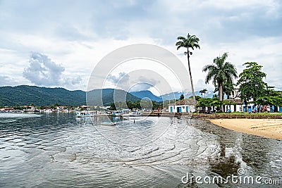 Port of Paraty, Brazil with colorful tourist and fishing boats in the bay between Rio de Janeiro and Sao Paulo Stock Photo