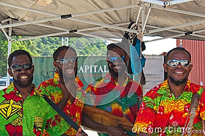 Kanak men singing and posing for tourists. Editorial Stock Photo