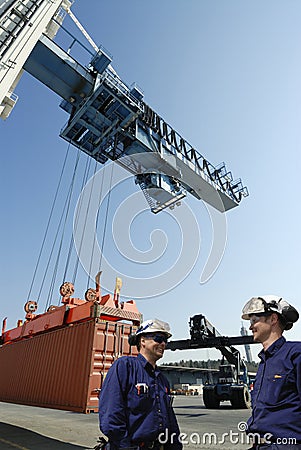 Port workers and container port Stock Photo