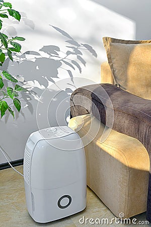 Portable dehumidifier colect water from air Stock Photo