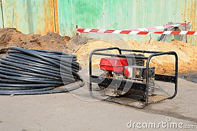 Portable electric generator. Repair of road work. Stock Photo