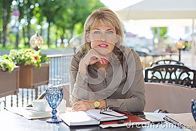 Portait of mature beautiful blonde woman looking at camera Stock Photo
