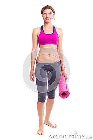 Portait of young woman with yoga mat. Stock Photo