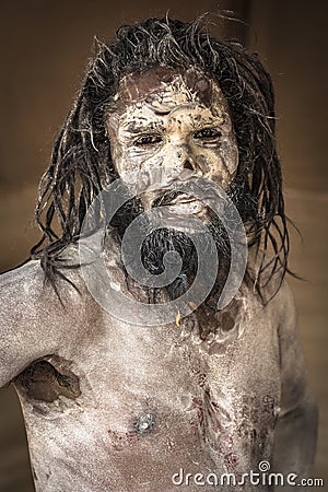 Portarit of a sadhu covered in ashes at the kumbh Mela festival. Editorial Stock Photo
