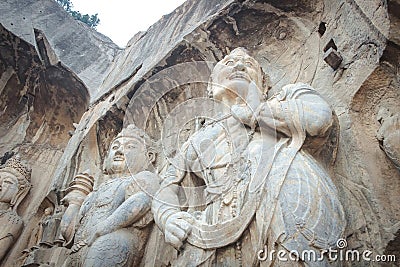 Porter`s statue rock carving at Longmen Grottoes, Luoyang, Henan Stock Photo