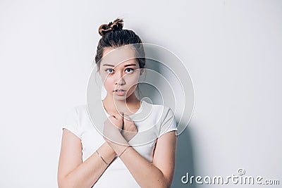 Porter young beautiful brunette woman crossing her arms on a white background Stock Photo