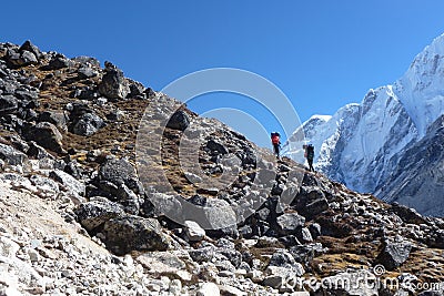 Porters over a difficult pass near Gorak Shep, Everest Base Camp trek, Nepal Editorial Stock Photo