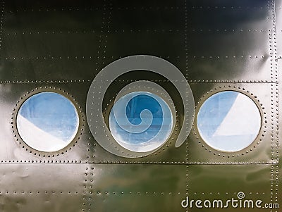 Portholes on old aircraft Stock Photo