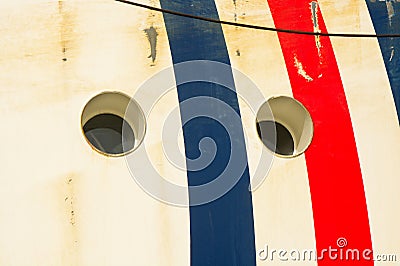 Portholes in ships hull Stock Photo