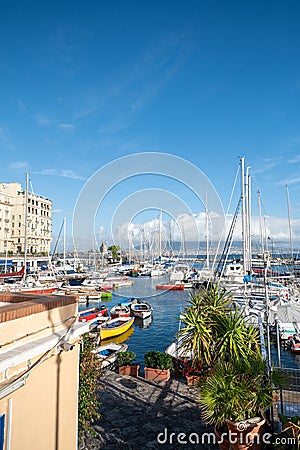 Porticciolo Santa Lucia di Napoli on a sunny day with Vesuvius in the background in the year 2023 Editorial Stock Photo