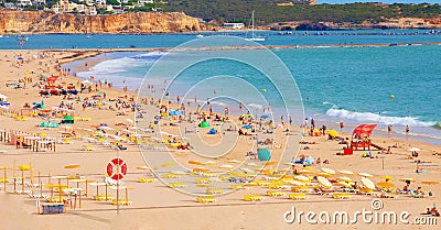 public beach in portugal on hot sunny day Editorial Stock Photo