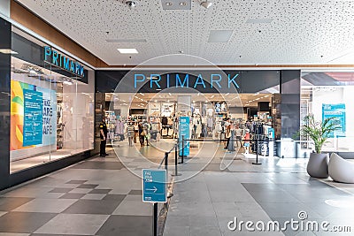 Portimao, Portugal - July 11, 2020: Access organization for social distancing in Primark fast fashion retailer. Input and output Editorial Stock Photo