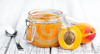 Portion of Apricot Jam on wooden background & x28;selective focus& x29; Stock Photo