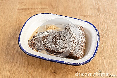 Portion of brownie cake with chocolate ice cream and icing sugar on top Stock Photo