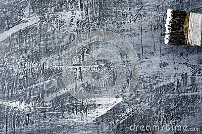 Portion of the brush in black and white paint on the background of a concrete painted gray background on the right above Stock Photo