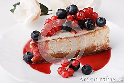 Portion of cheese cake New-York with berries Stock Photo